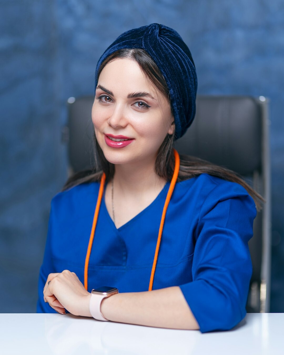 Studio portrait of a friendly Croatian woman coordinator smiling