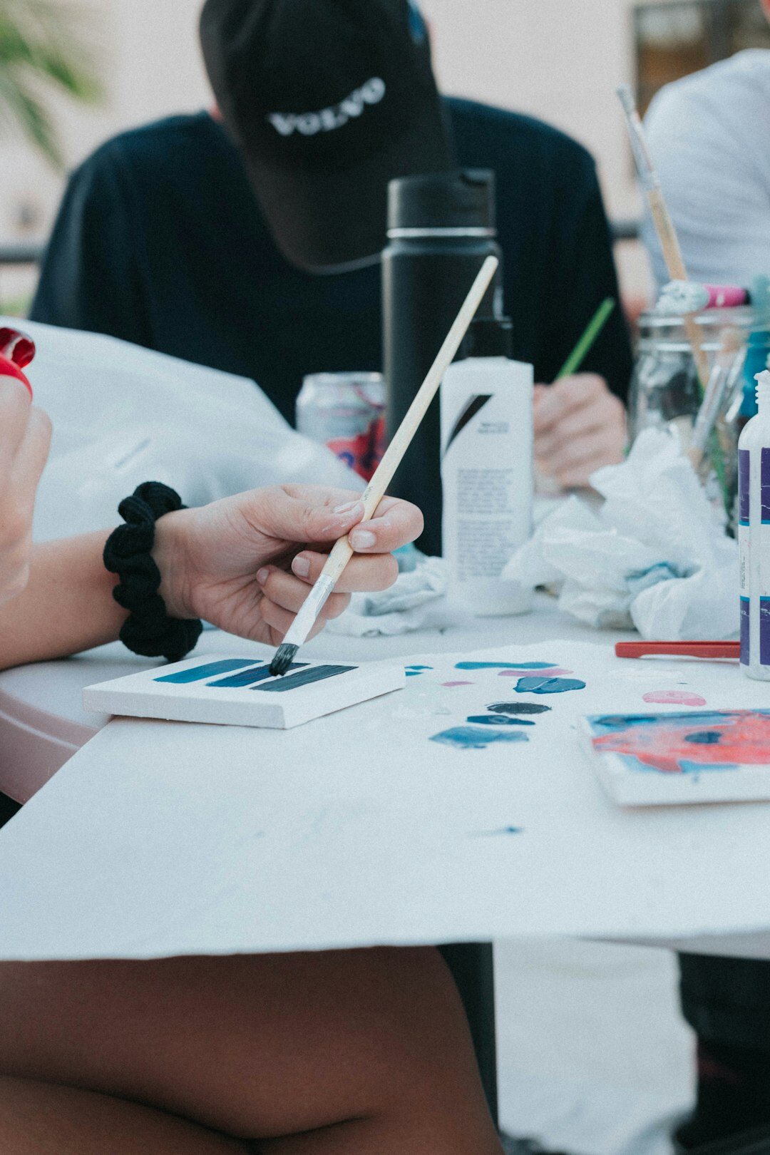 Seniors painting together during an art workshop