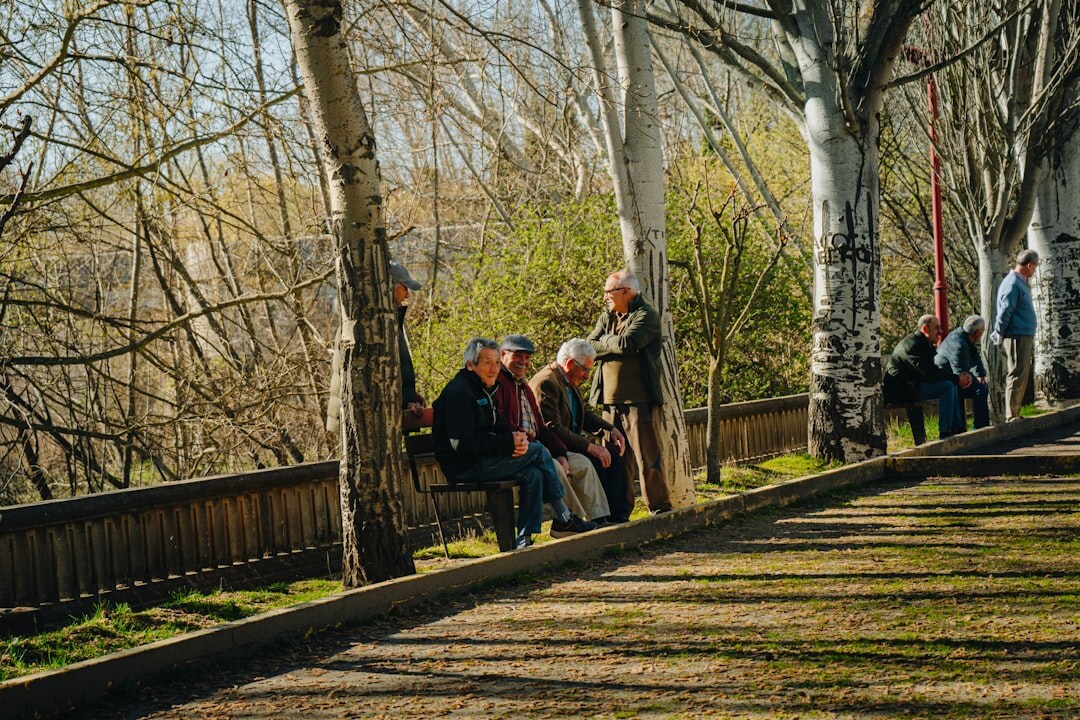 elderly people walking in park